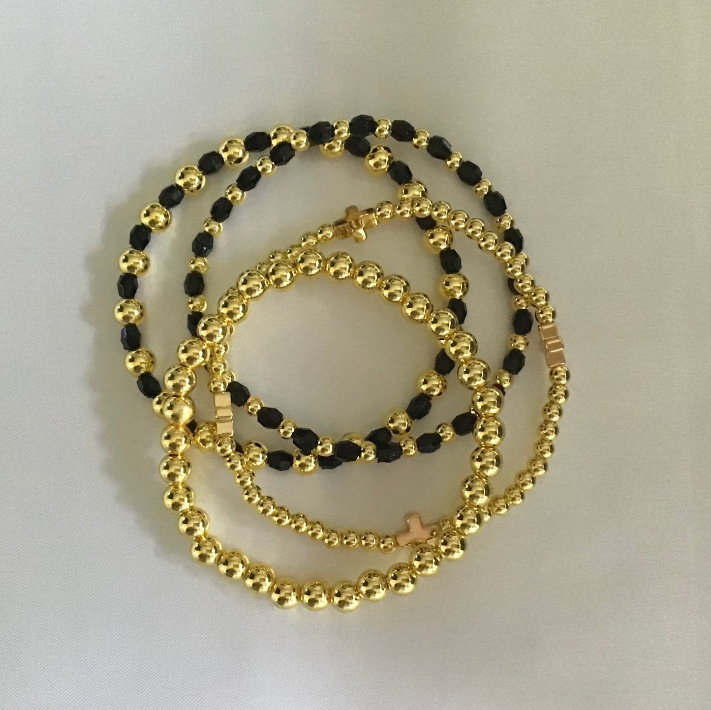 Stackable 18k Gold beaded Bracelet Set. Black.Cross.Gold.