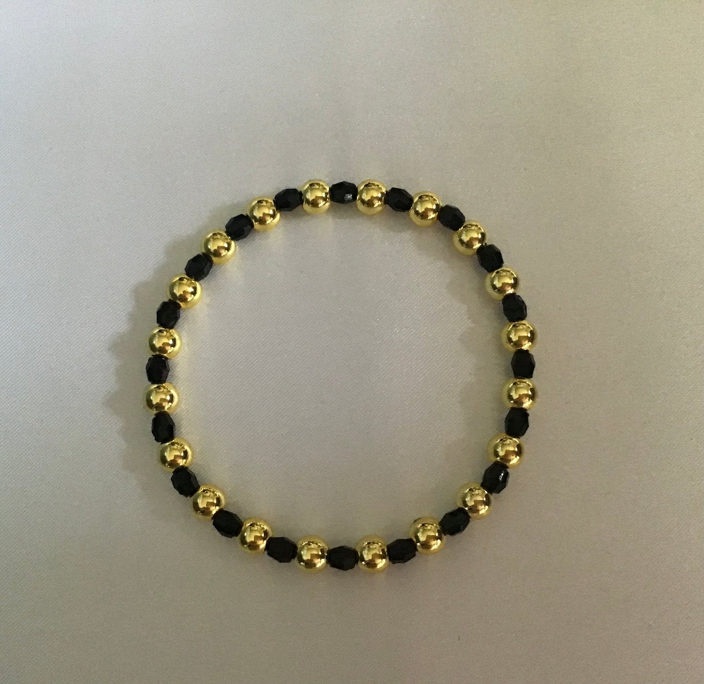 Stackable 18k Gold beaded Bracelet Set. Black.Cross.Gold.